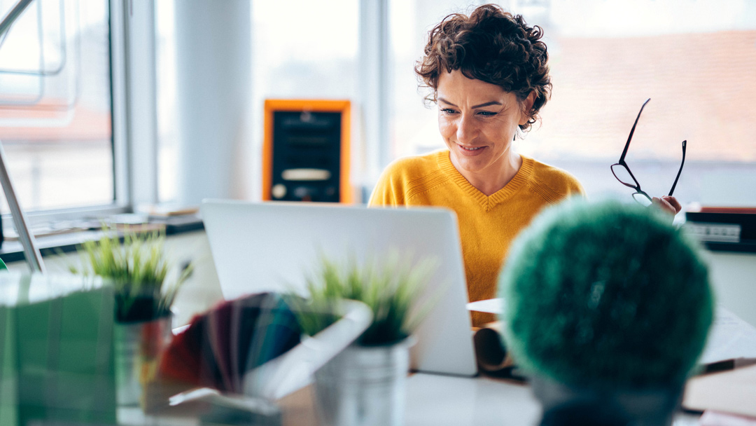 woman smiling on computer