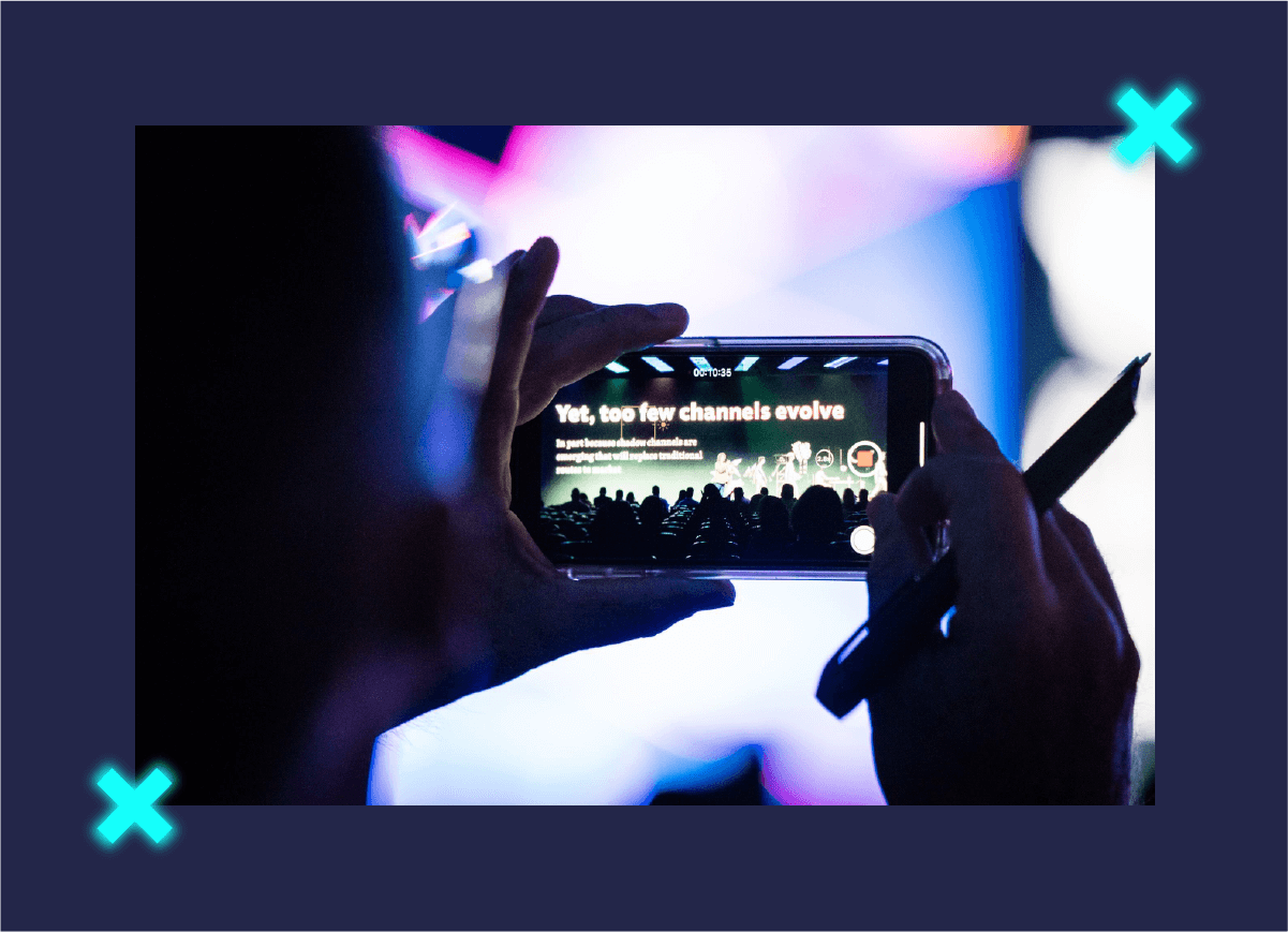 Attendee taking photos on their phone at NextCon 2019