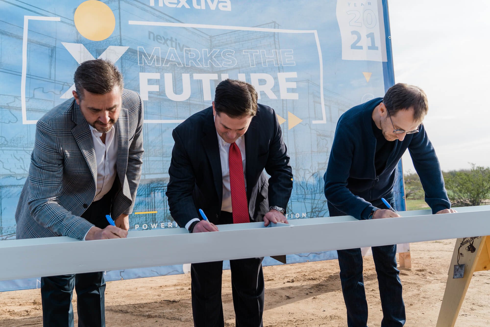 Nextiva Co-Founders and Governor Doug Ducey Sign Iron Beam for New Office in Scottsdale