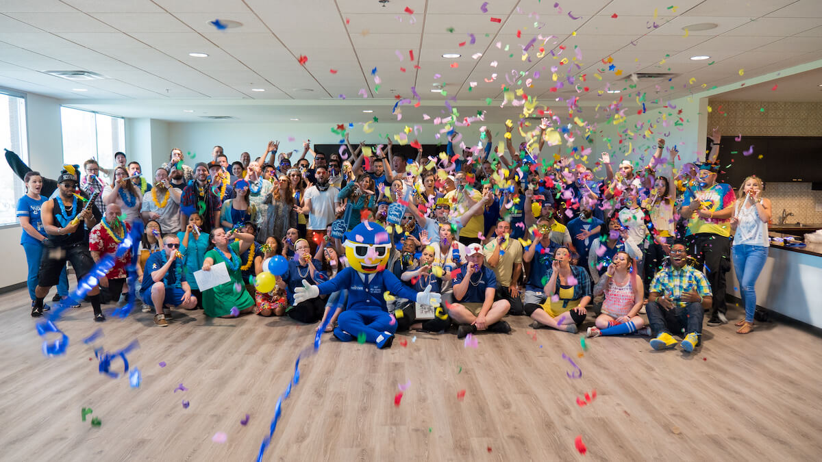 Group Photo of the Nextiva Team at an All-Hands Meeting