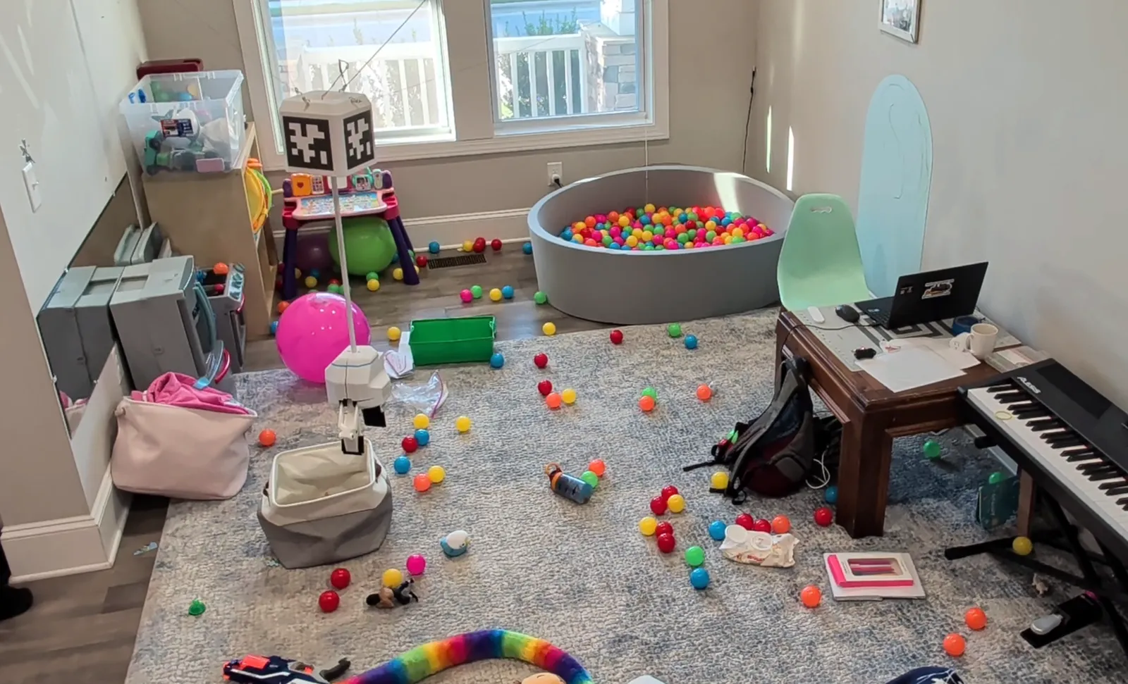 Stringman hanging in a messy room
