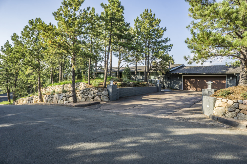 Hillside Outdoor Living with Natural Water Feature