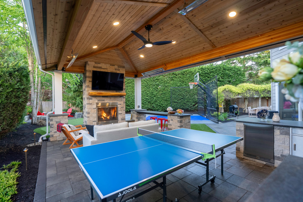 Ping pong table, fireplace and TV