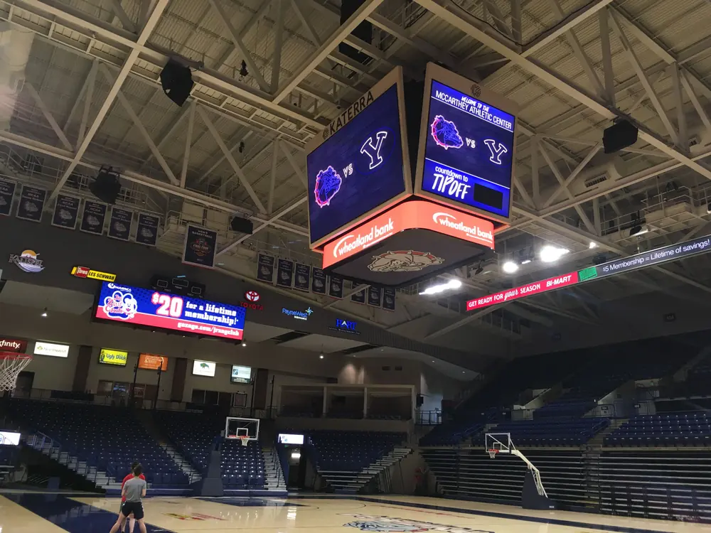 over head scoreboard and wall signs