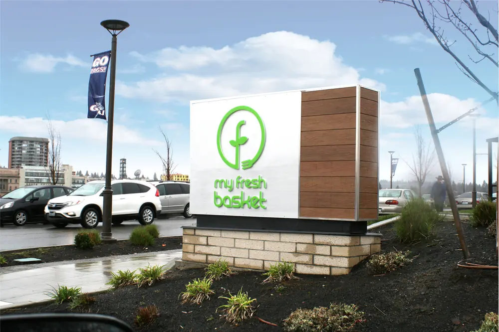 Internally Illuminated Monument Sign with detail matching the composite material on the building.