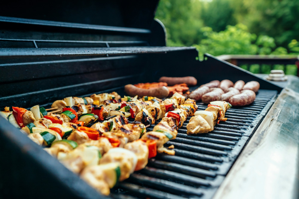 kababs and sausages on bbq. Photo by Evan Wise on unsplash