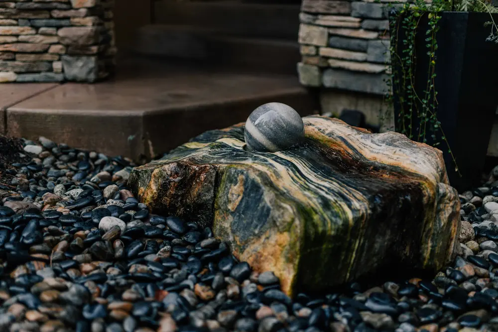 Spinning water orb by front door — Water Features by Cross Creek