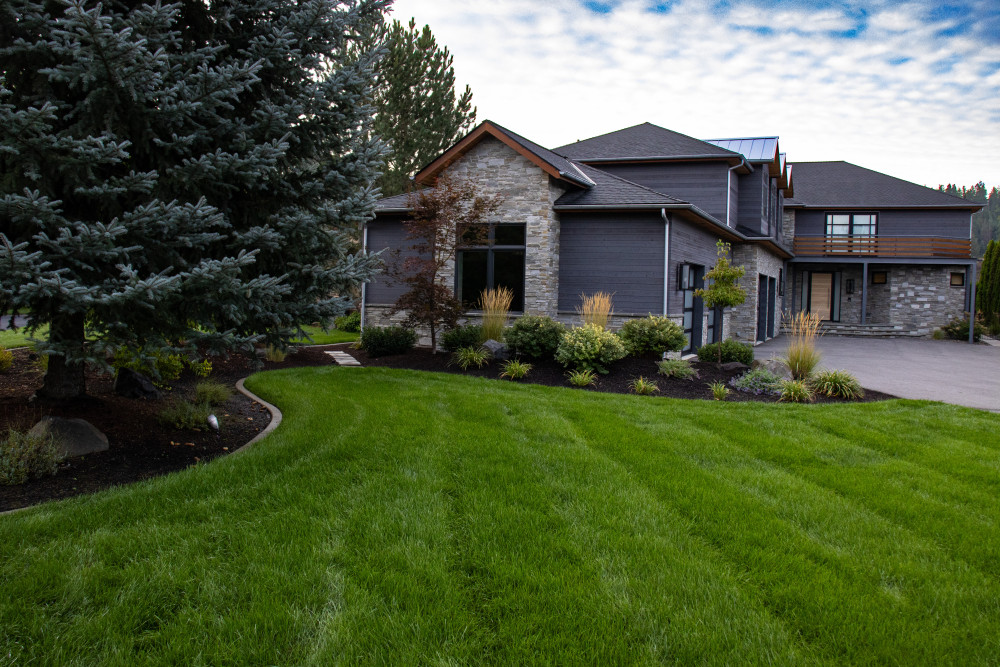 mowed grass and landscaped bed after detailed cleanup