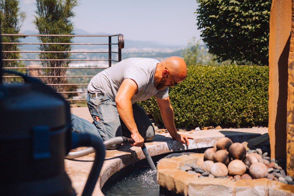 water feature cleaning with water vacuum