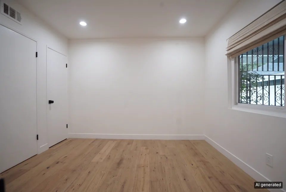A home office emptied, the walls, the window and the floor untouched. Before, the same room with its desk and rug.