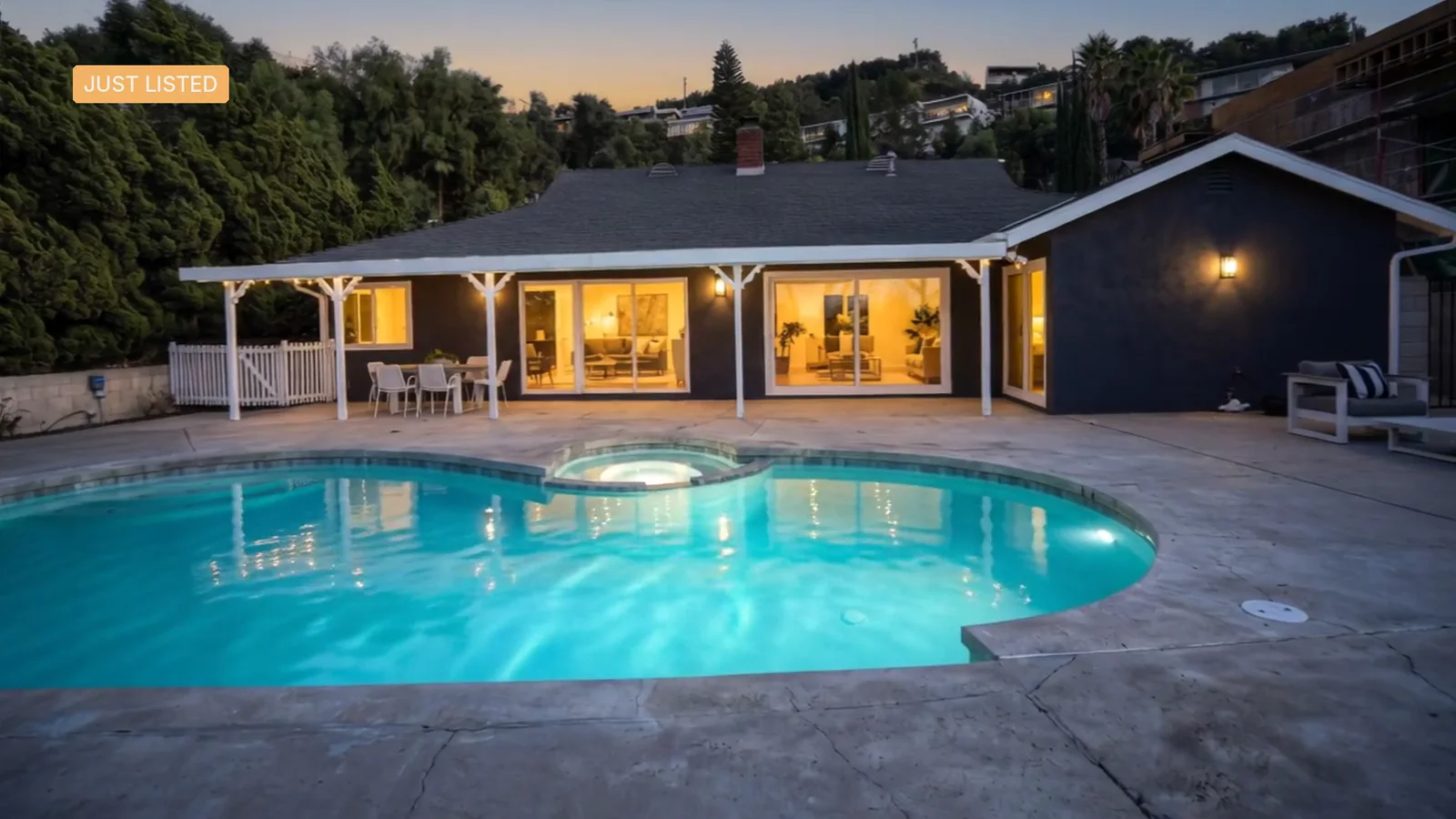 A reel of Realtour outputs of one hillside pool home: the pool at twilight, Upbeat's titles in the kitchen, an empty bedroom revealed staged, the drone glide, Luxe's lettered name and Classic's price.