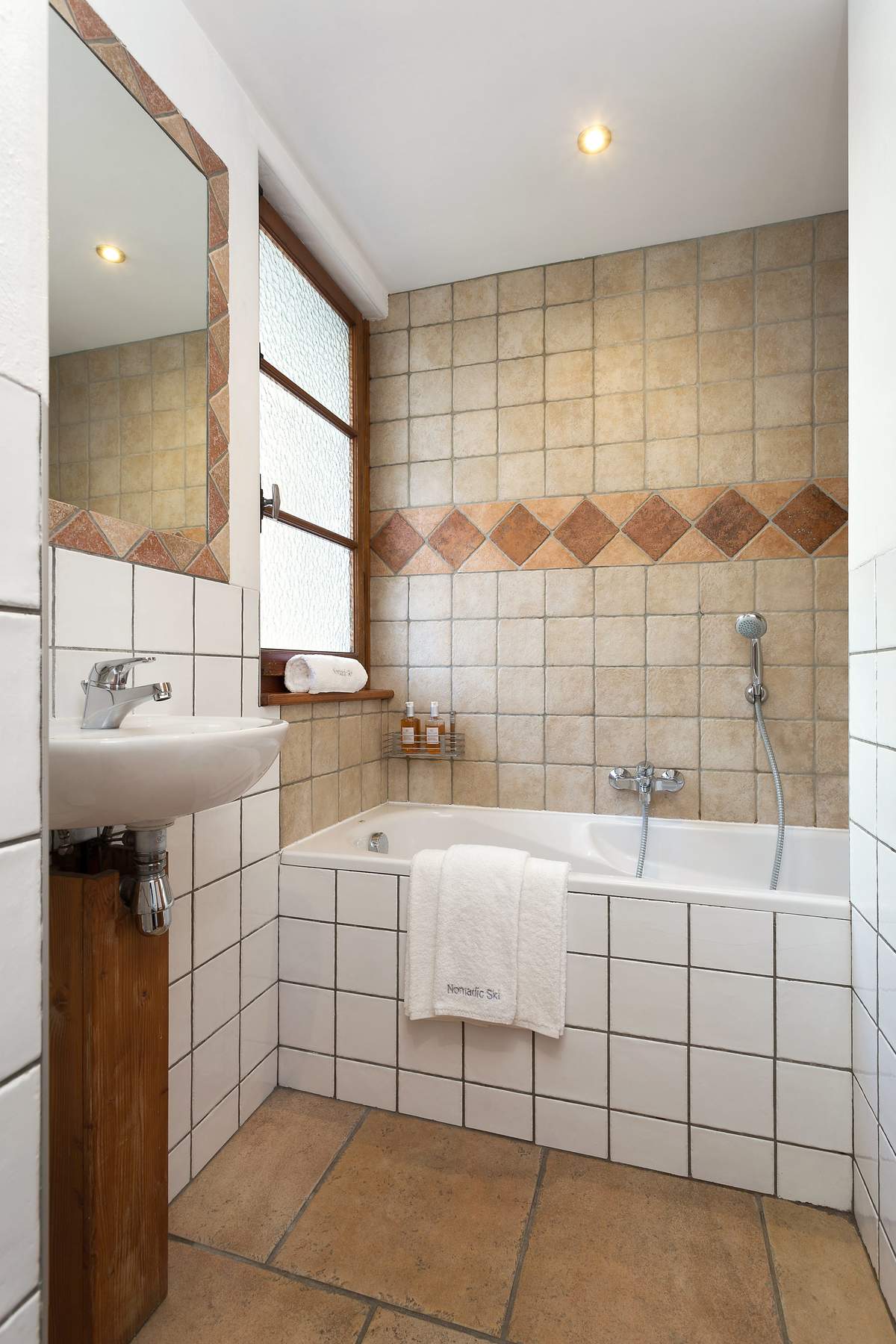 2 bathrooms have bath-showers and toilets