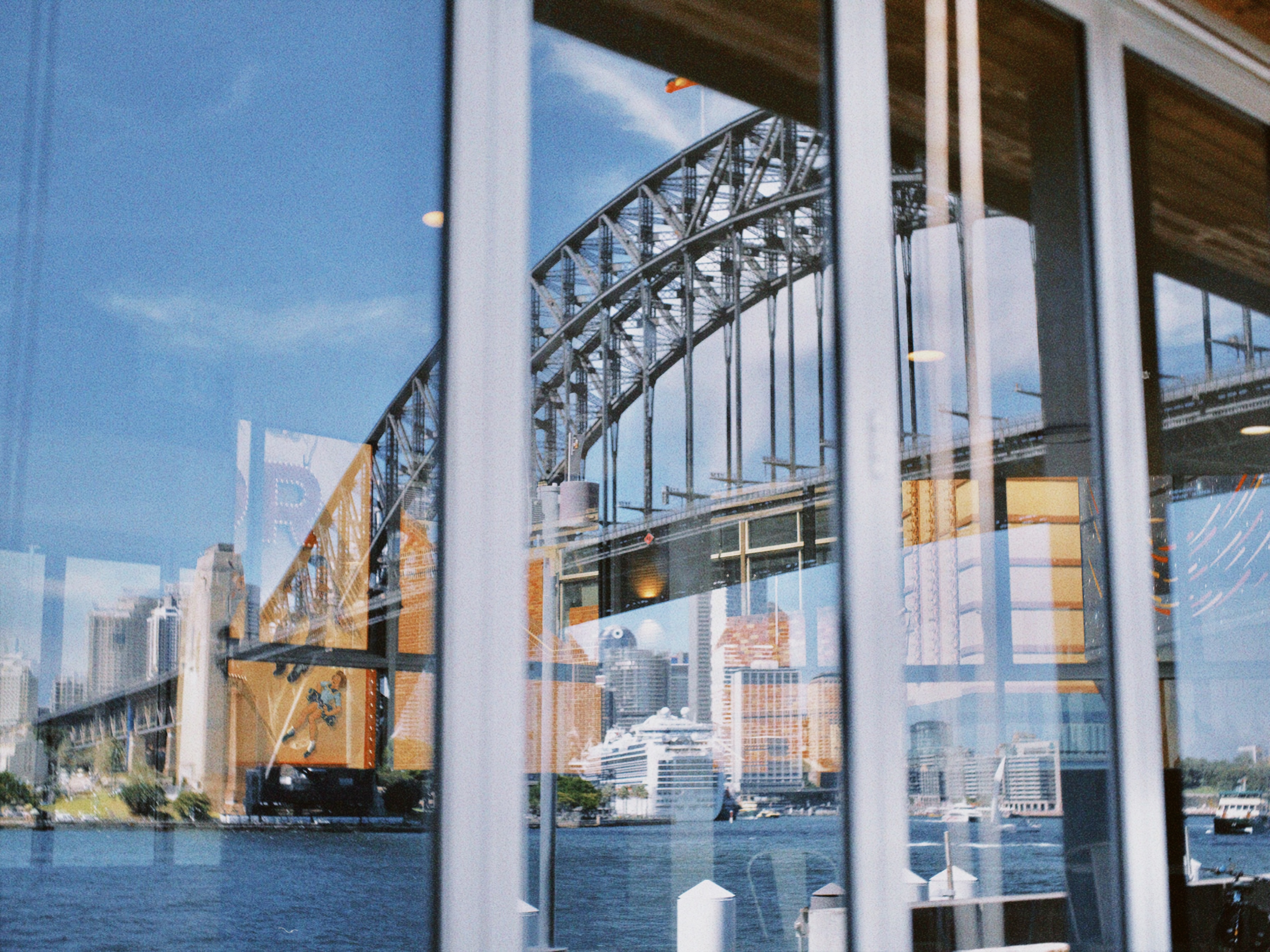 Reflection of a bridge in coffee shop windows