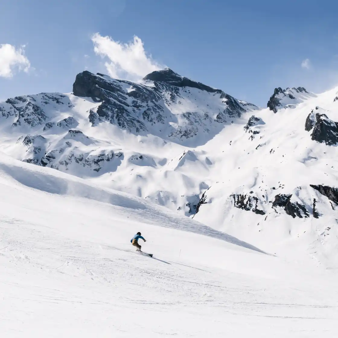 Skier on the slopes of Piau Engaly, snow and sun