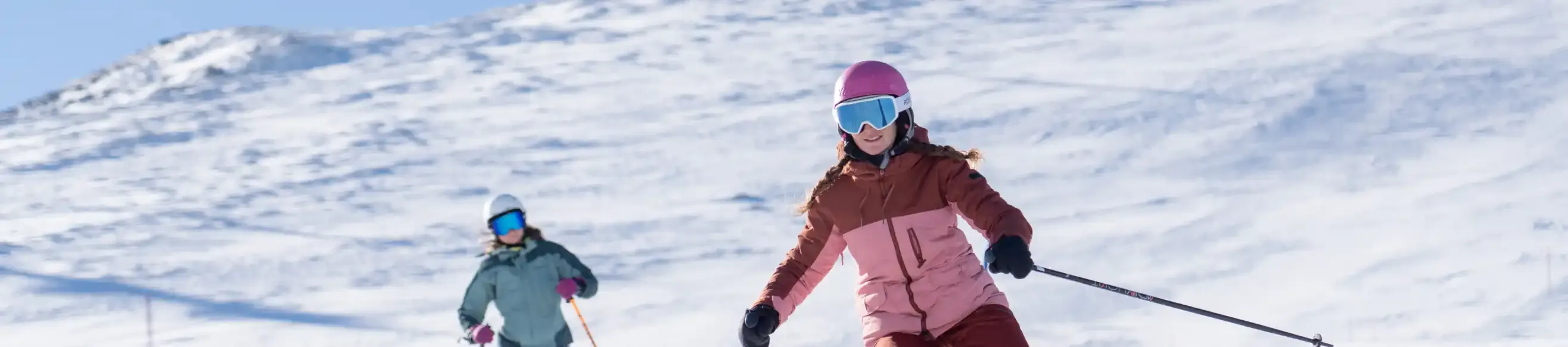Two skiers hurtling down the slopes of Luz Ardiden