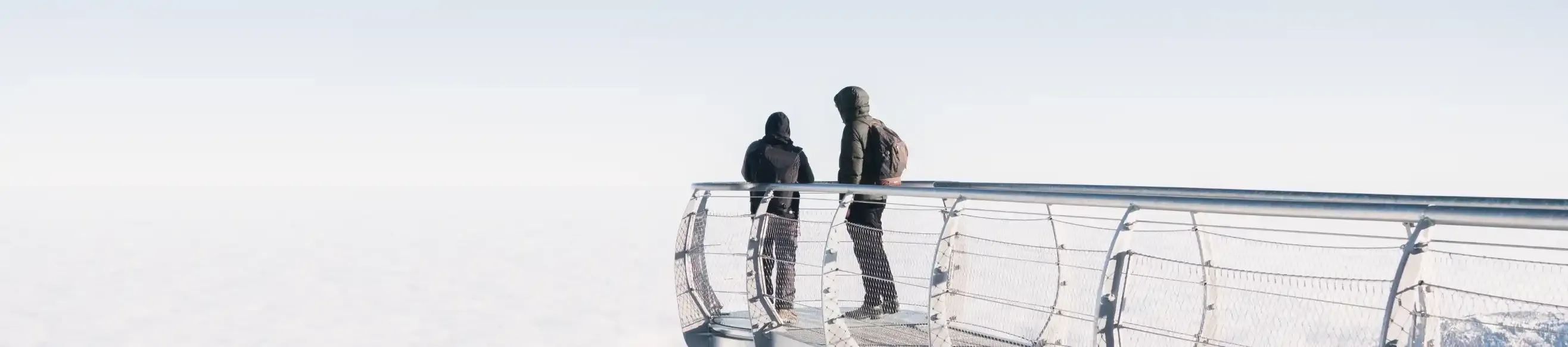 Two people on the suspended walkway of the Pic du Midi