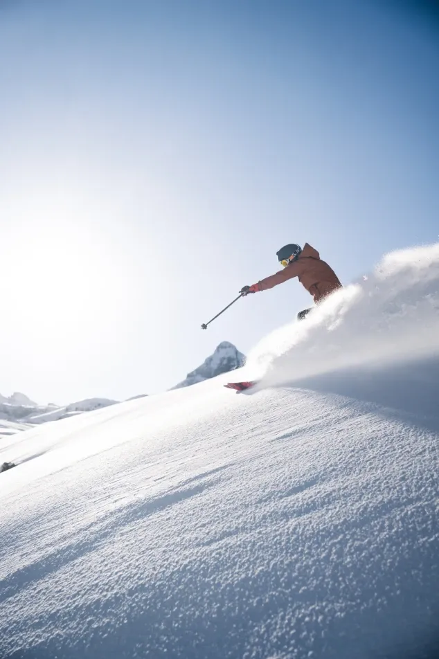 Skier skiing in powder snow