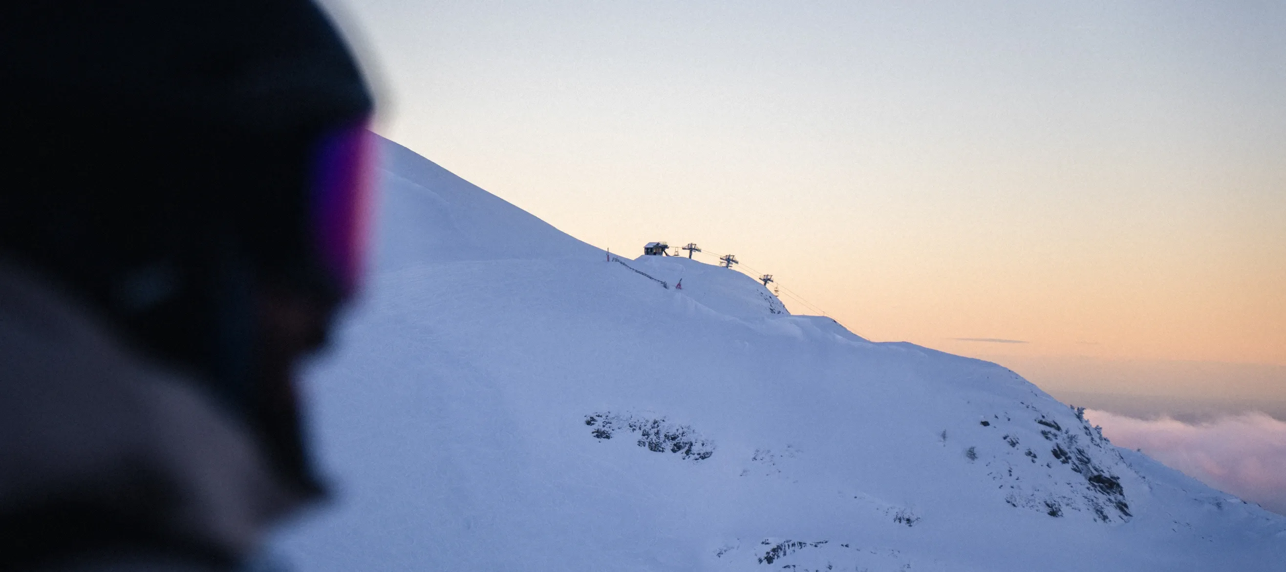 Skier looking at a ski slope in winter