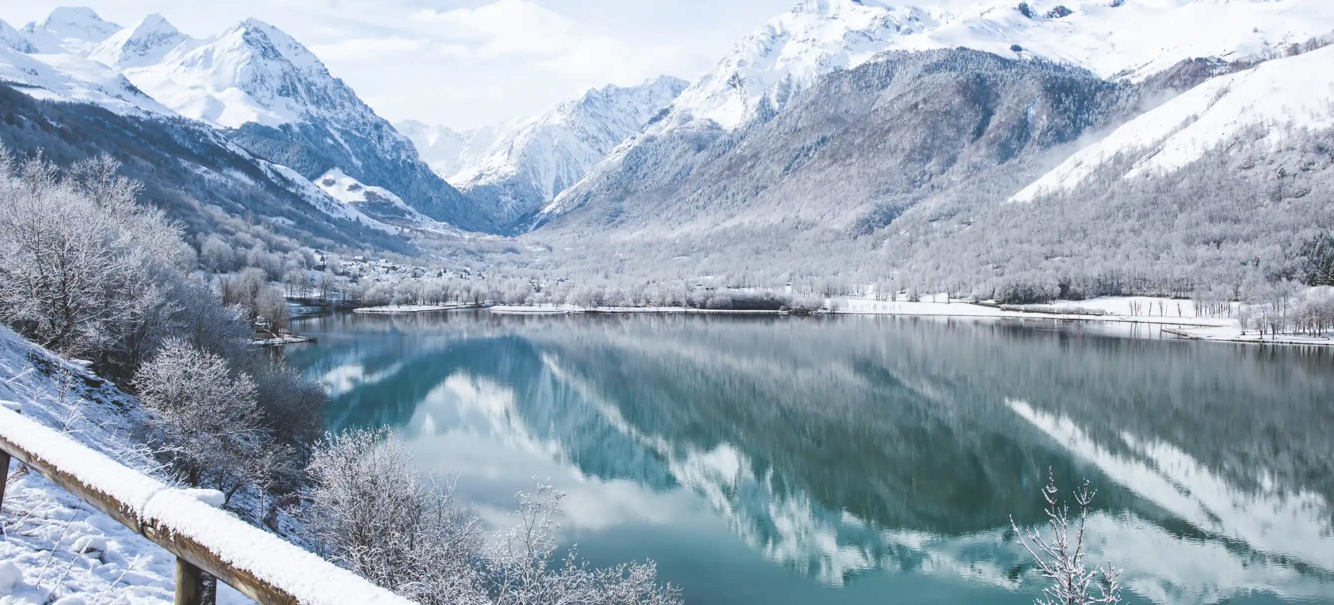 Panorama of Lake Genos, Loudenvielle. Snow-covered