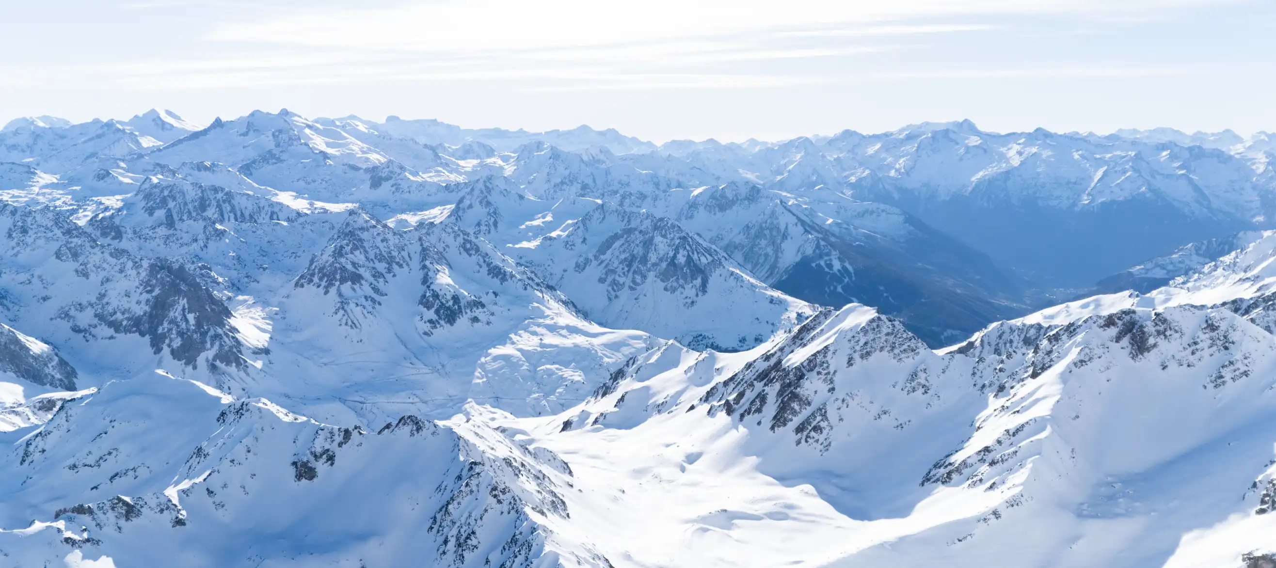View from the Pic du Midi on the Pyrenean peaks in winter during the day