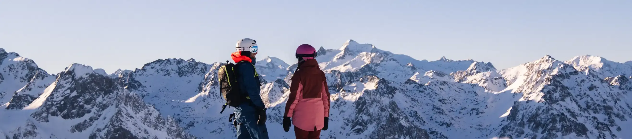 Two skiers watching the slideshow of the Grand Tourmalet