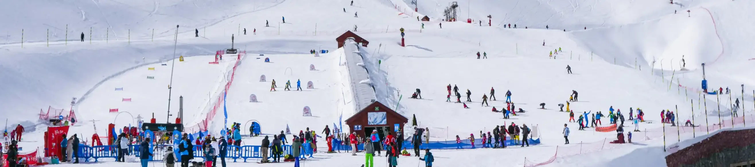 Child on the green slopes of Cauterets taking a lesson