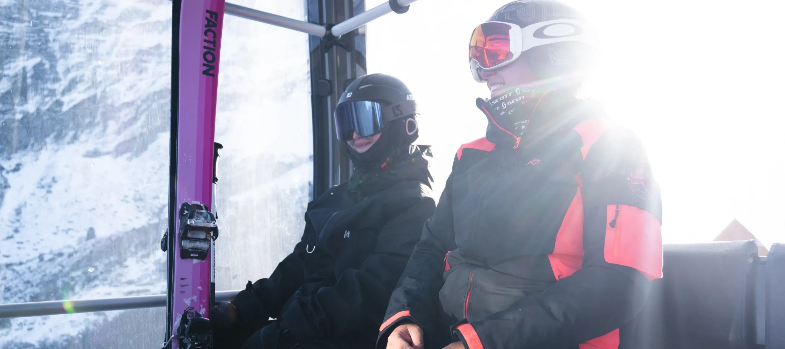 Happy skiers in a gondola