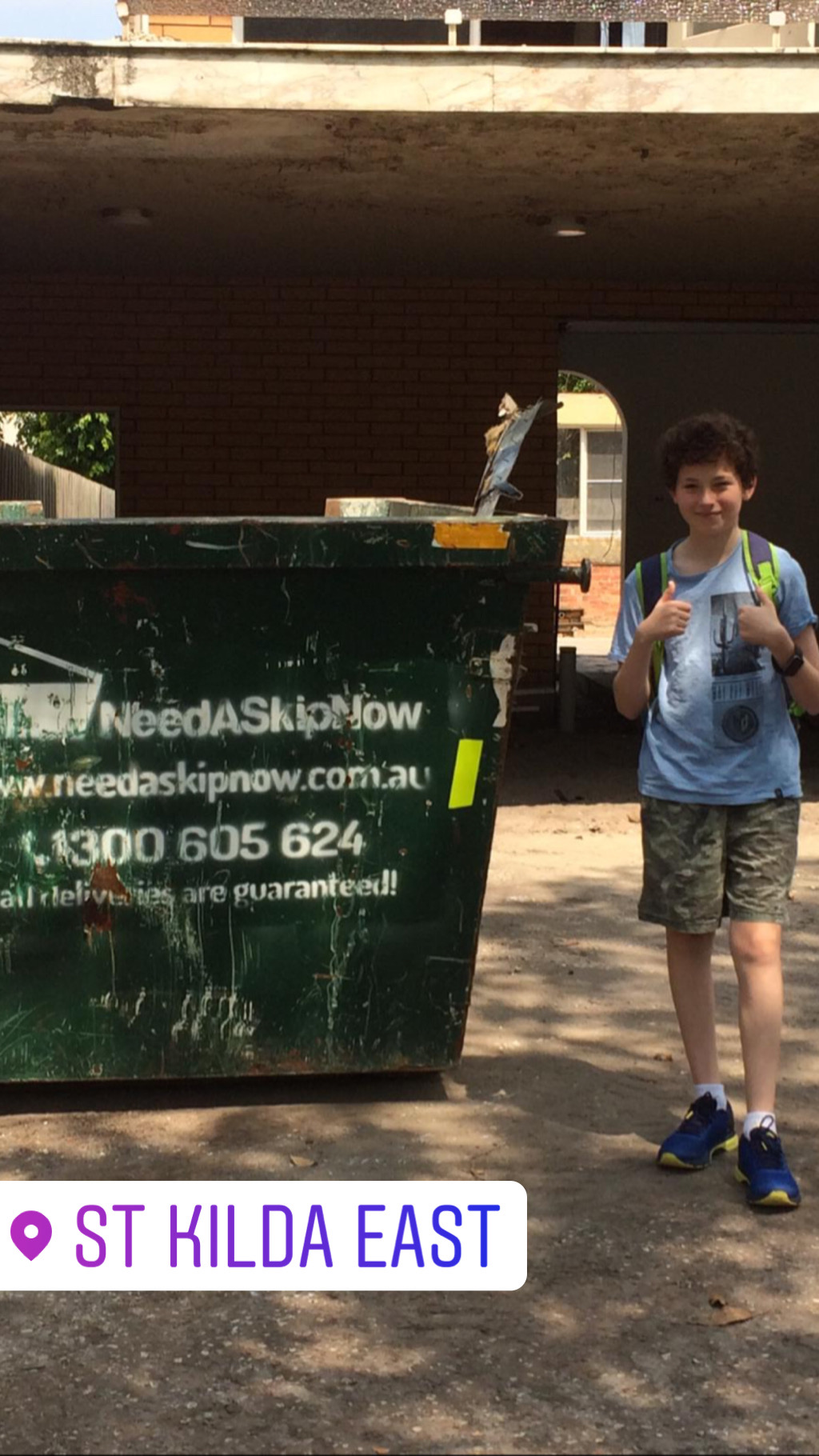 moving house kids helping to load a skip bin