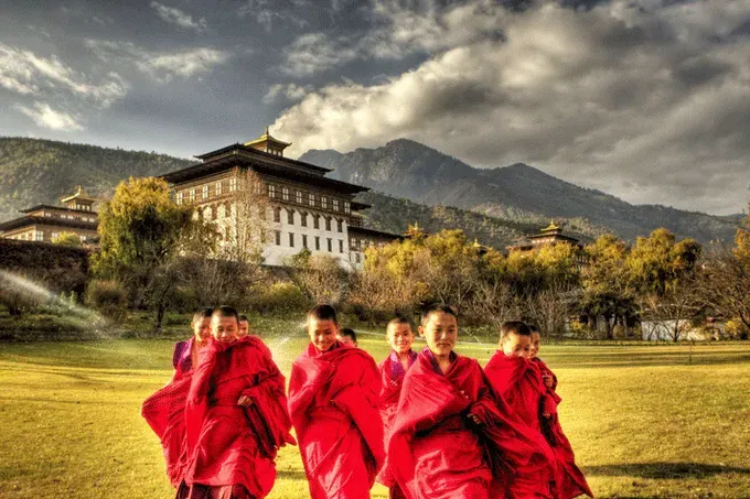 An elderly Bhutanese woman with prayer beads.