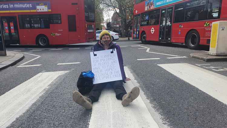 Fio, 72-year-old artist from Furzedown, blocking traffic in Sloane Street