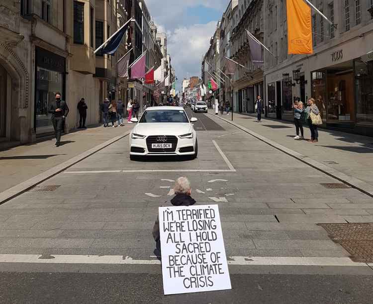 Nathaniel, 48-year-old filmmaker from Balham, sitting at the end of Old Bond Street