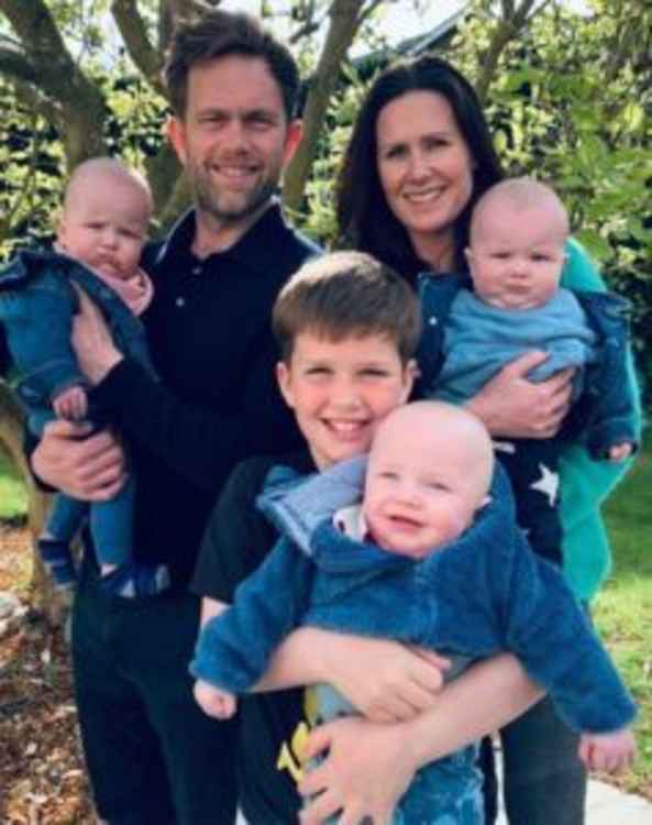 Susie and Andy with their triplets, Vinnie, Eddie and Max.  Credit: St George's