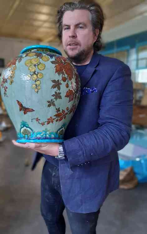 Chris Kirkham holding the vase