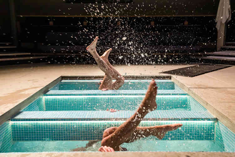 Eitan and Avi taking part in the Jewish ritual of submerging in the water - photo by The Other Richard from The Mikvah Project