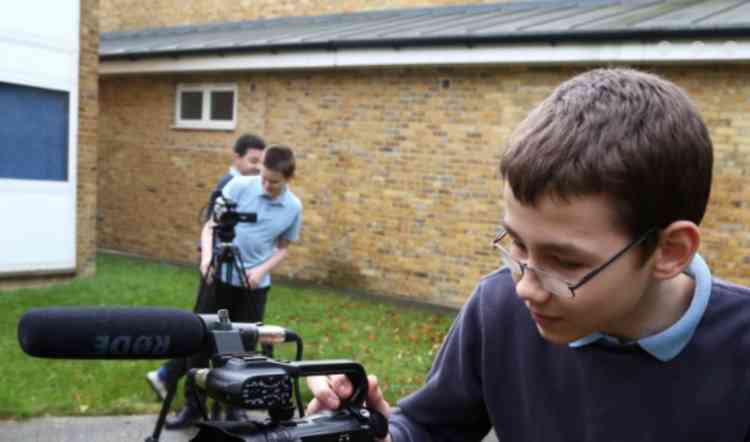 Beckmead pupils using video camera equipment