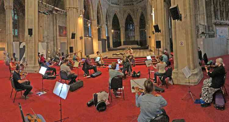 A socially distant Richmond Orchestra strings section