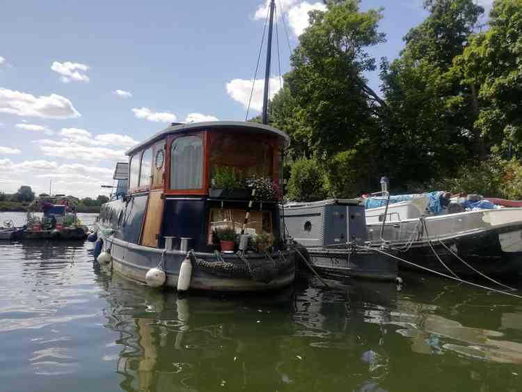 Paddleboarding gives an opportunity to see the many house boats up close