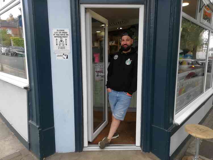 In the doorway of the barbers in Red Lion Street