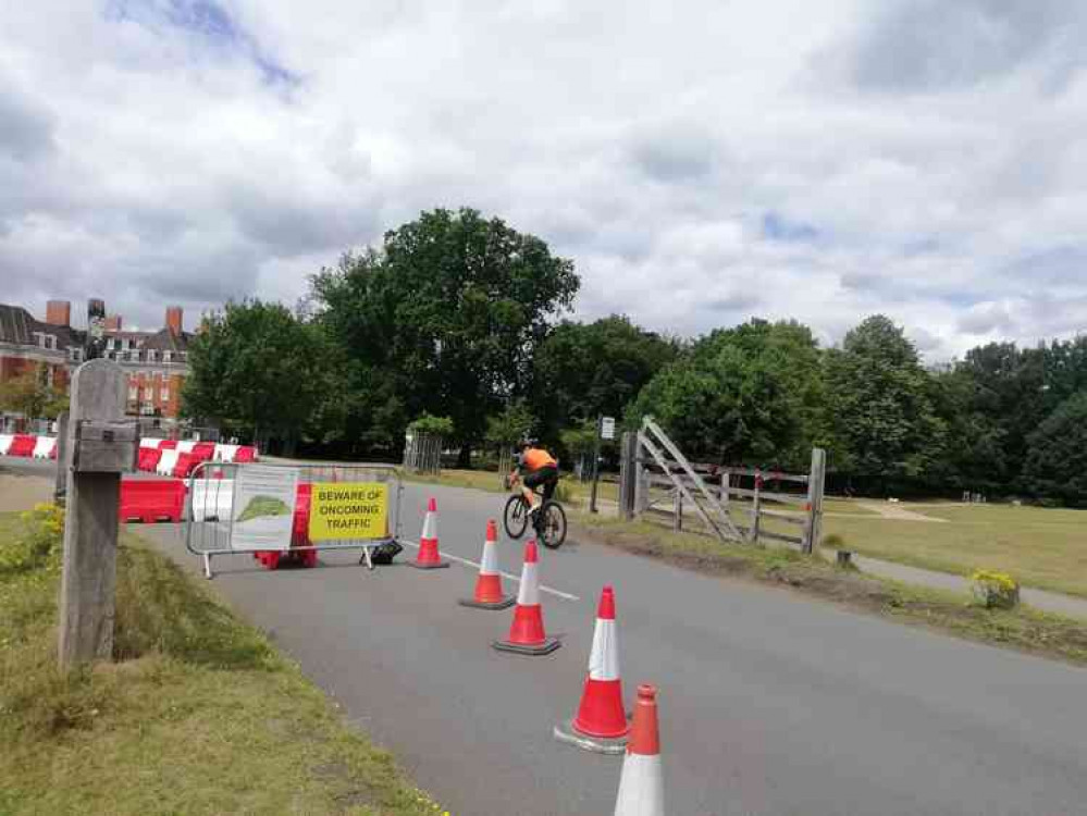 A cyclist in the park near Richmond Gate (stock image)