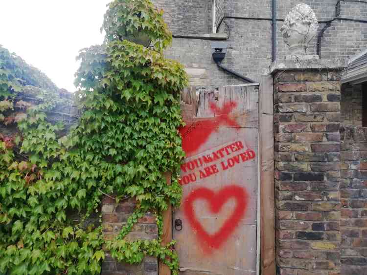 A positive message spraypainted onto a door