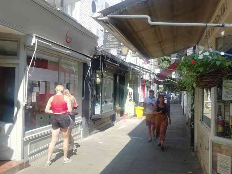 Shoppers in Paved Court