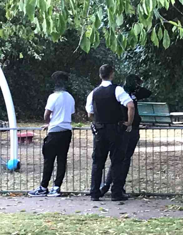 Officers questioning youths in the park