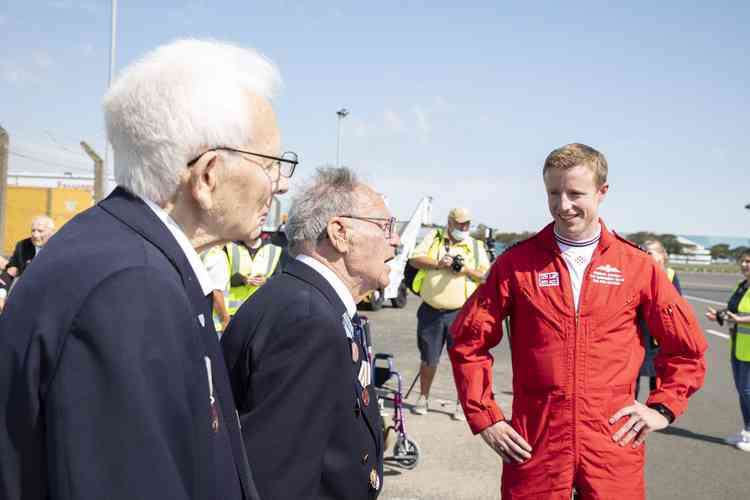 A Red Arrows pilot with the former servicemen. All photos by @rafredarrows on Twitter