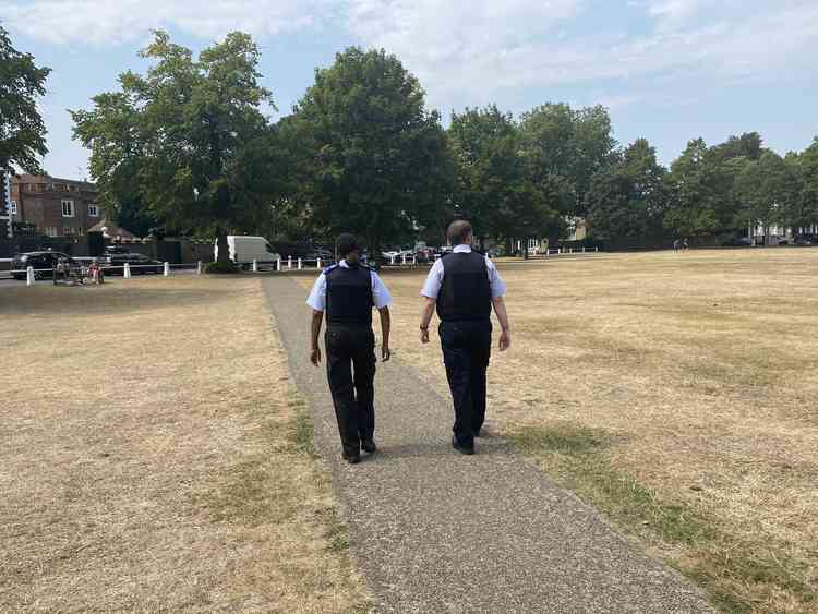 Officers patrolling a quiet Richmond Green