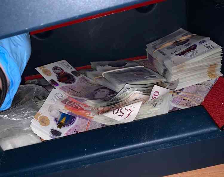 Cash was also seized by officers