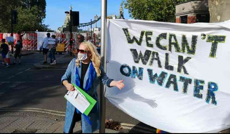 'We can't walk on water' - Cllr Julia Cambridge with her banner