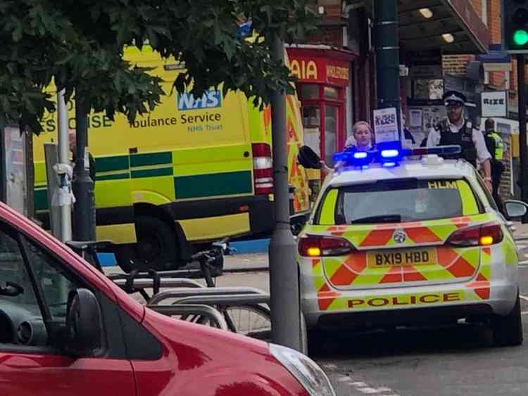 Police and ambulance vehicles at the scene