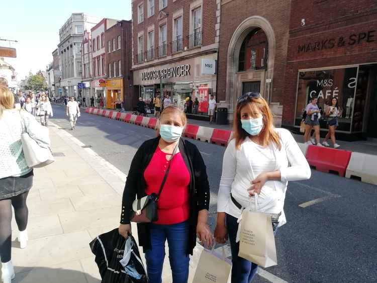 Bernadina, left, and Patricia with their purchases