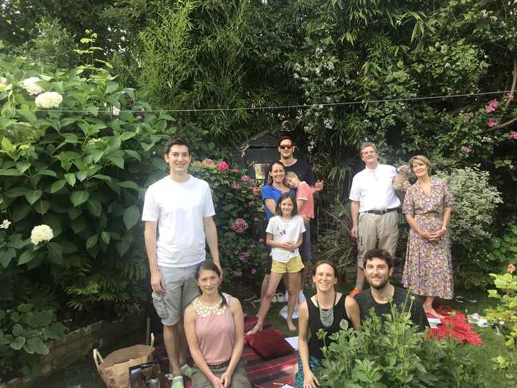 At his home in Kew with his three sons and their partners