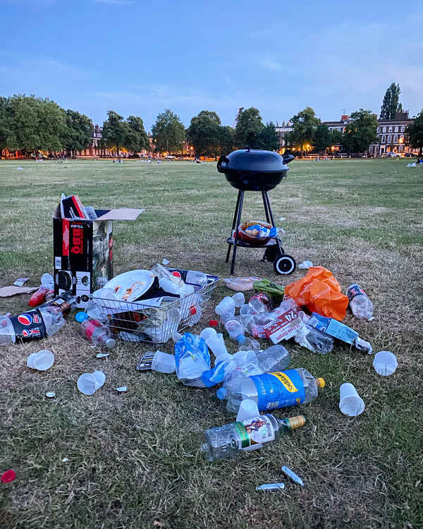 Rubbish left behind by people partying on Richmond Green